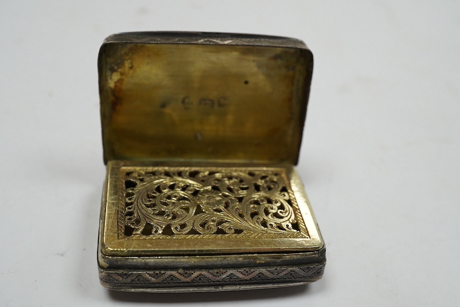 A late George III silver rectangular vinaigrette, John Thropp, Birmingham, 1819, 39mm and one other foliate scroll engraved silver vinaigrette, Birmingham, 1845. Condition - poor to fair